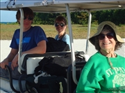 Beatriz, Katarena, Enrique loaded and ready to go in the golf cart taxi, Caye Caulker airstrip